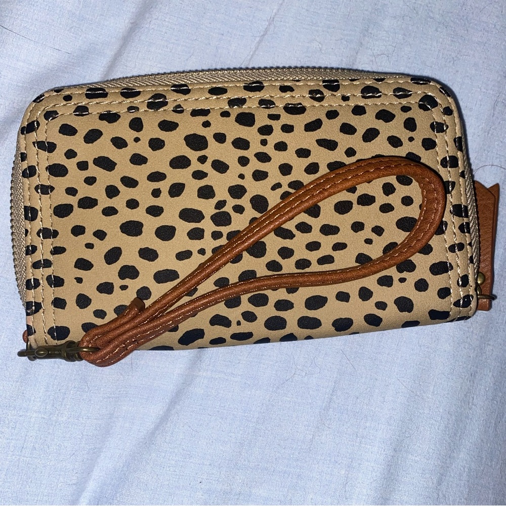 Tan and Black Animal Print wallet; roughly 3.5” by 6”.